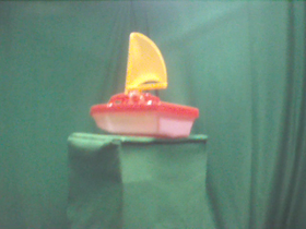 135 Degrees _ Picture 9 _ Red and Yellow Toy Sailboat.png